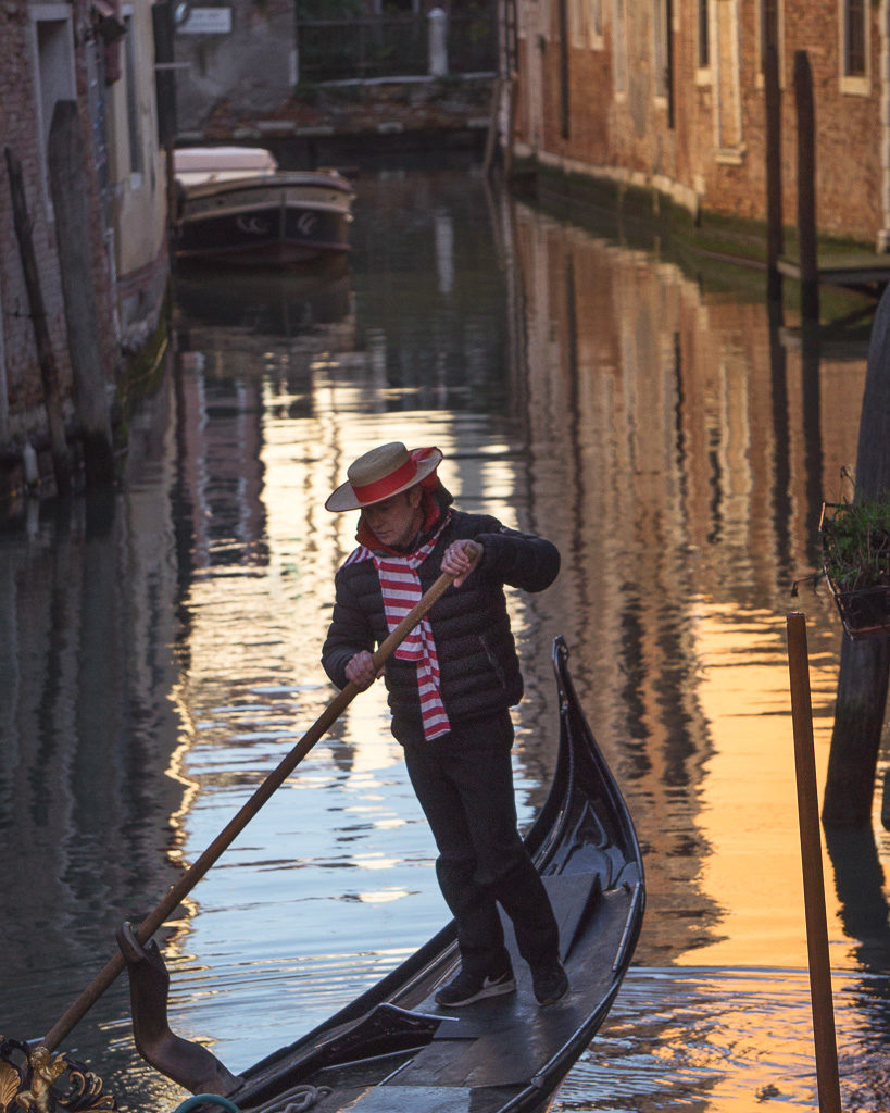 Classic gondola in Venice on quiet canal