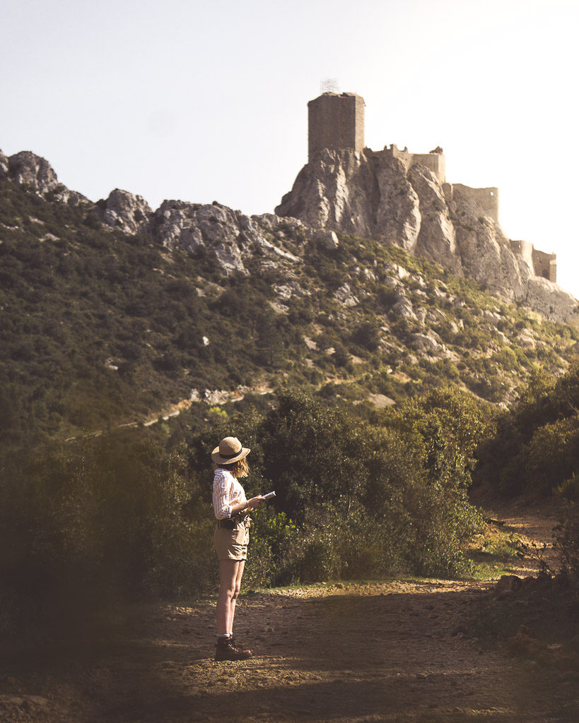 Queribus castle is an absolute classic along the Cathar Way and in the Languedoc more generally. Here Nell is caught map reading, but actually gazing up at the towering castle above her.