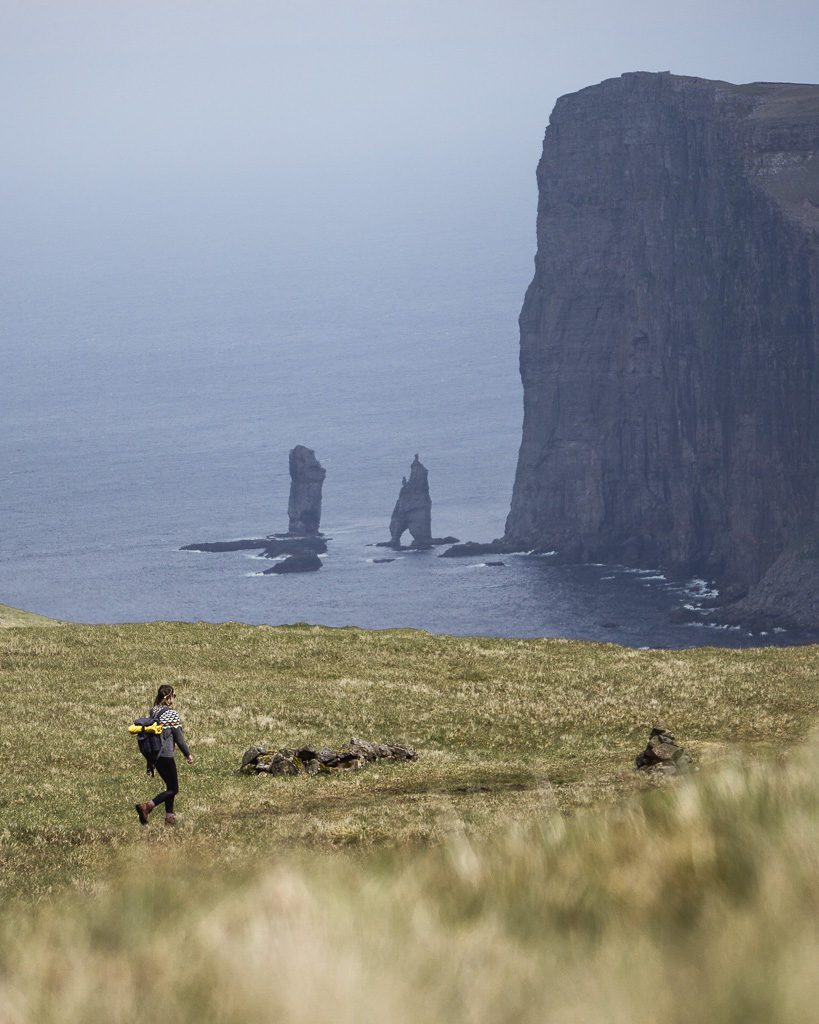 Sea stacks of the Faroe Islands - Nell enjoying another hike along clifftop paths with views to die for.