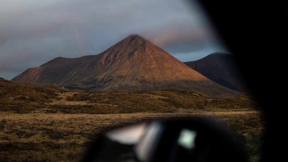 View out of the window of car looking to the Red Hills on Skye